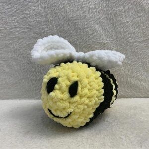 Yellow and black handmade crochet bee soft toy